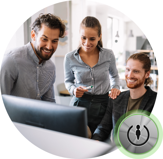 3 persons looking at computer smiling